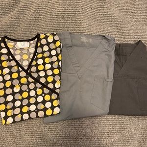 Three scrub tops and bottoms.